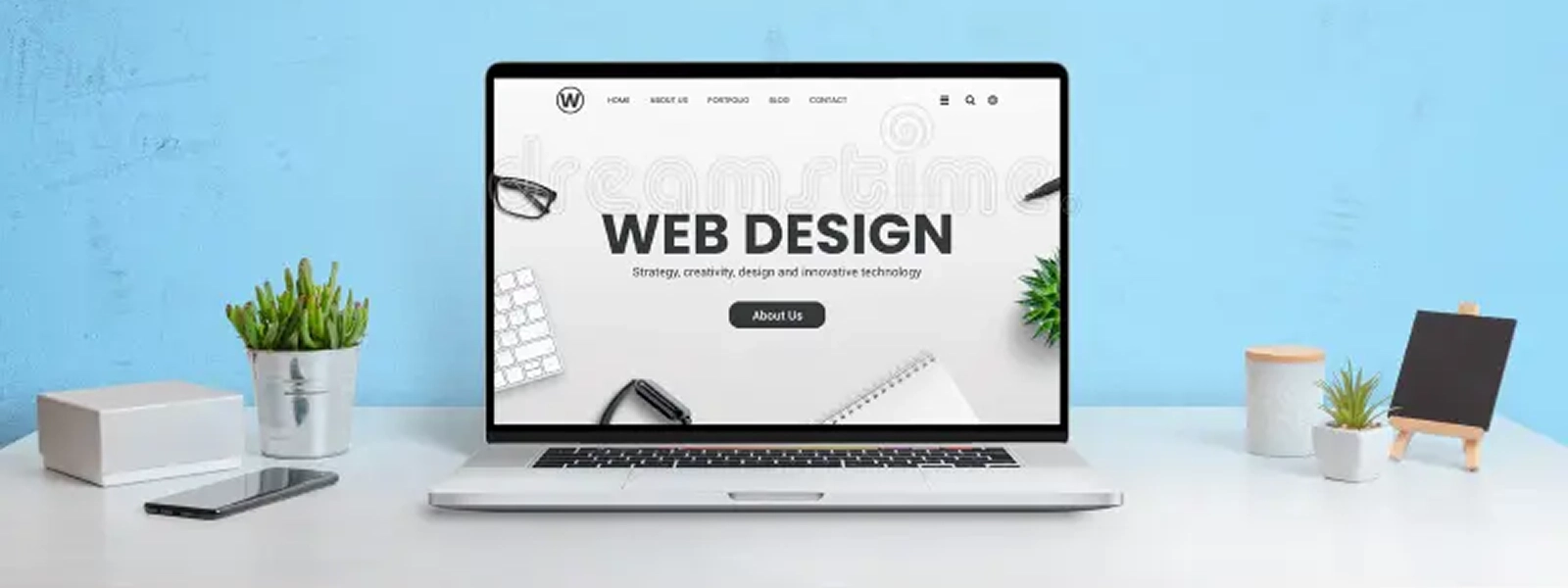 modern-website-web-design-company-presented-laptop-computer-work-desk-blue-wall-background-194387597 1